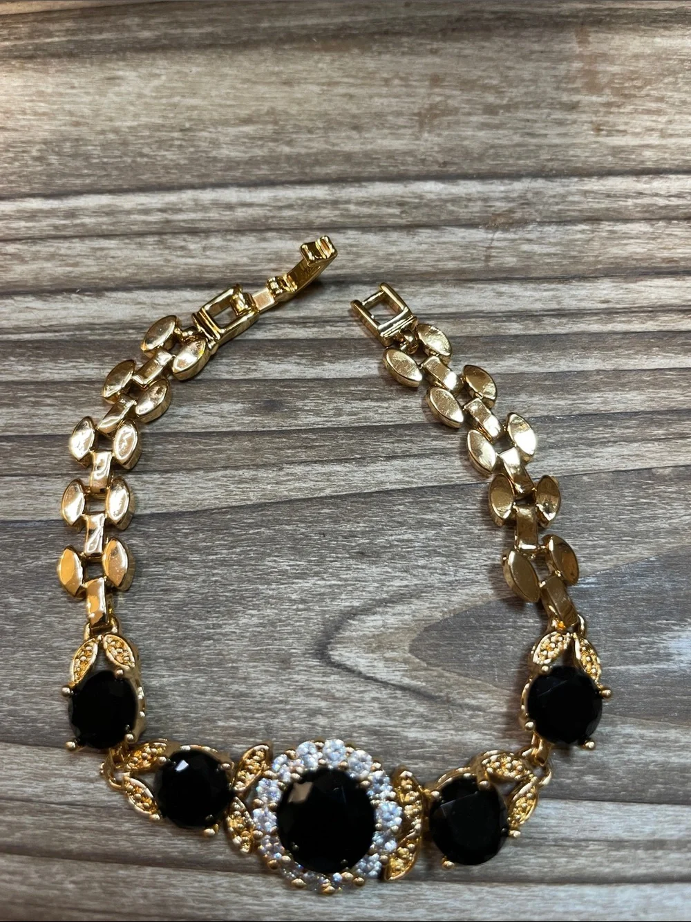Gold-Tone Bracelet with Black Glass Gemstones and Clear Accents